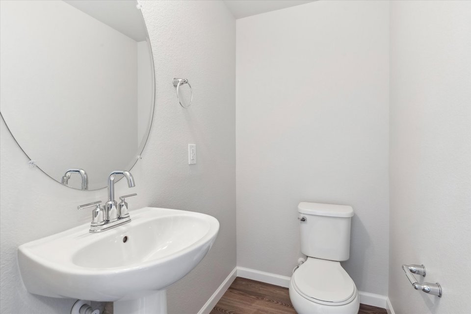 A bathroom with a toilet and sink.