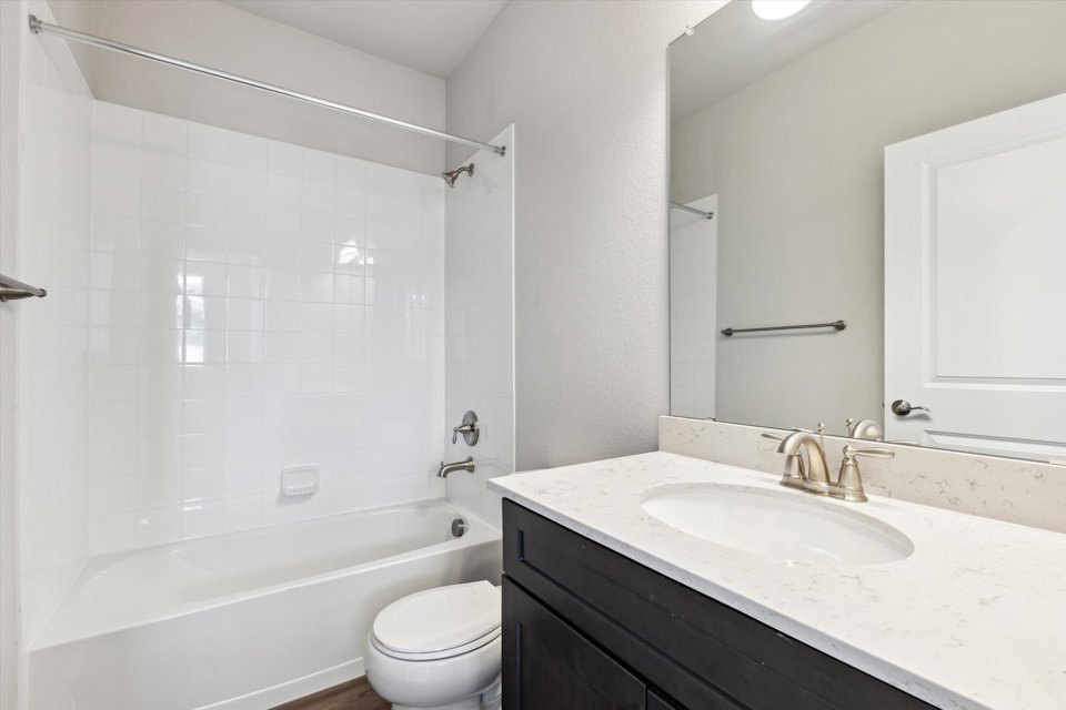 A bathroom with a sink and a bathtub.