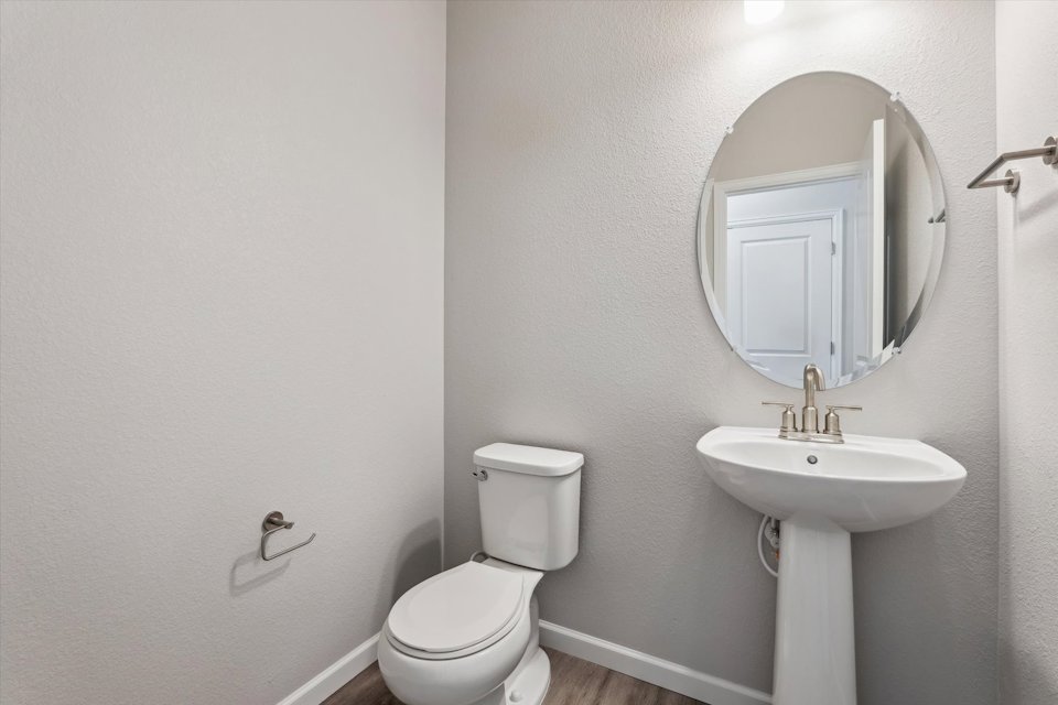 A bathroom with a sink and toilet.