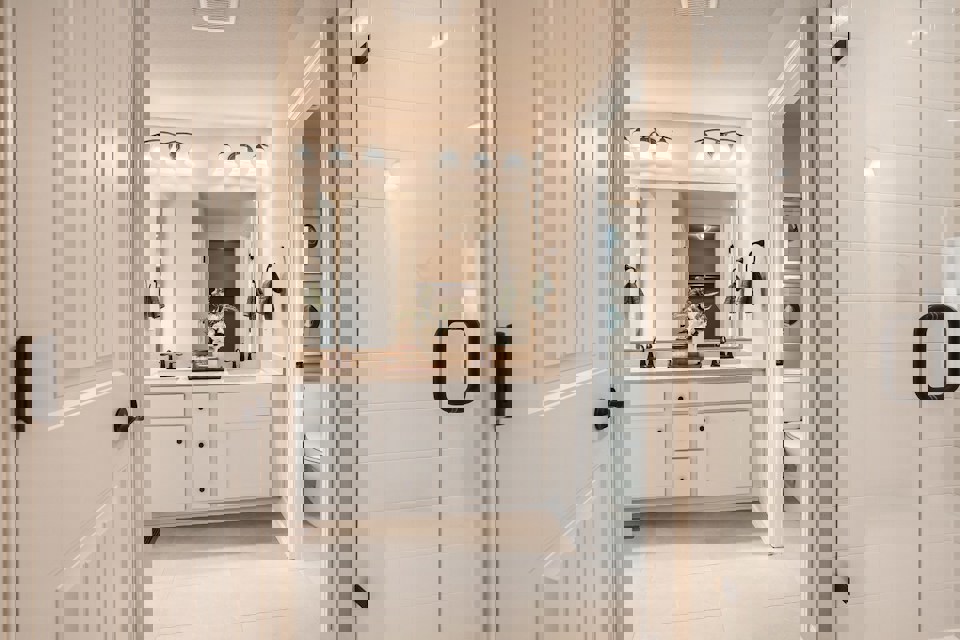 A bathroom with a shower and sink.