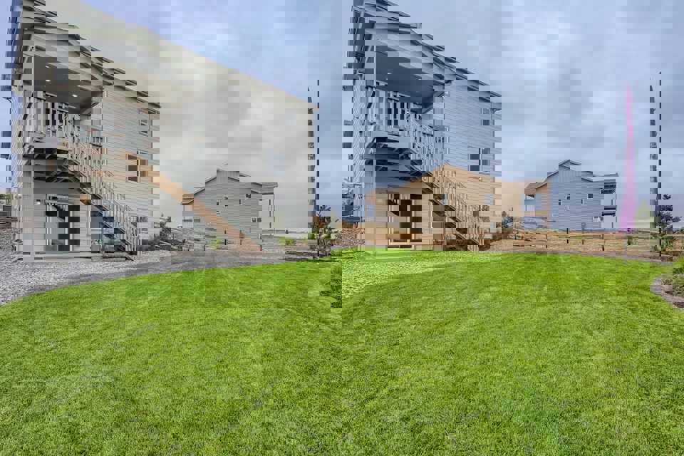 A house with a grass yard.