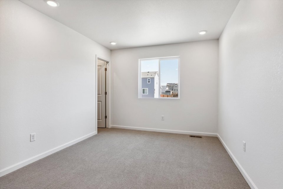 A hallway with white walls.