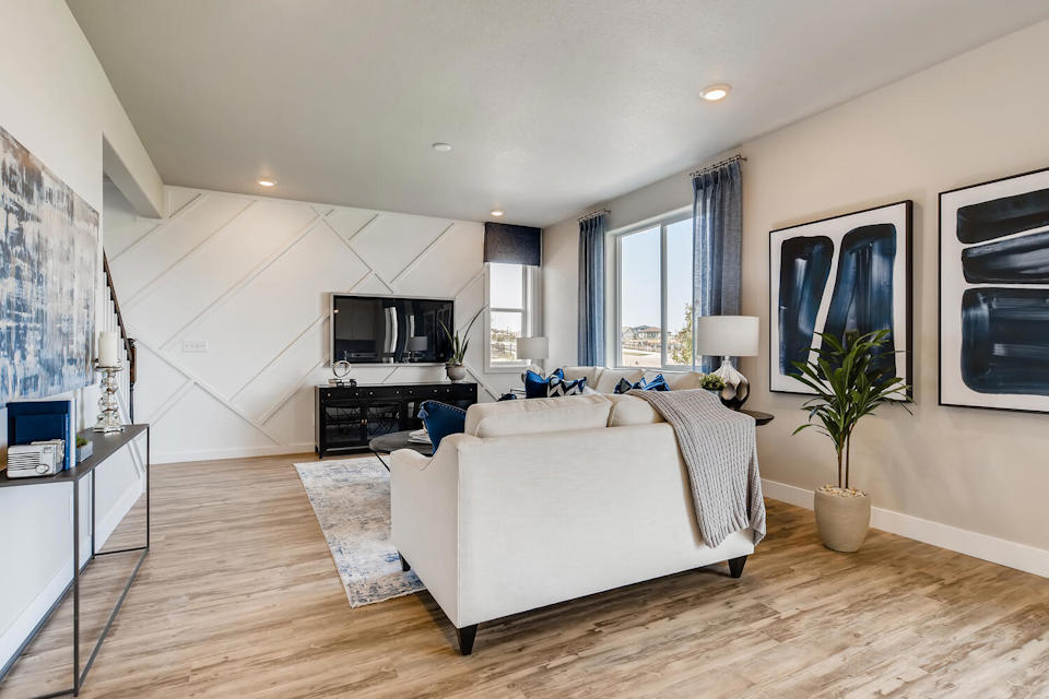 A living room with a white couch.
