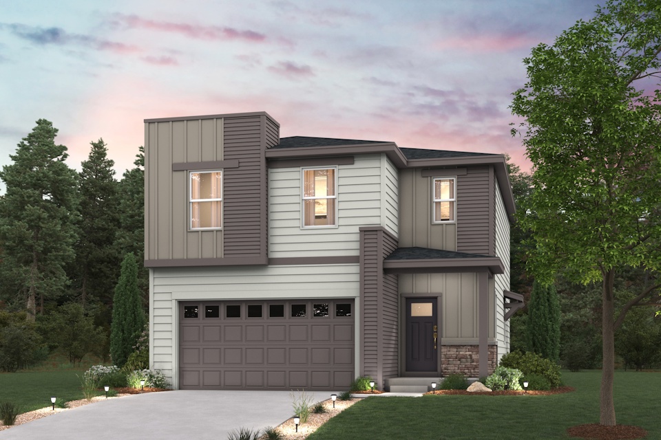 A house with a garage and trees around it.
