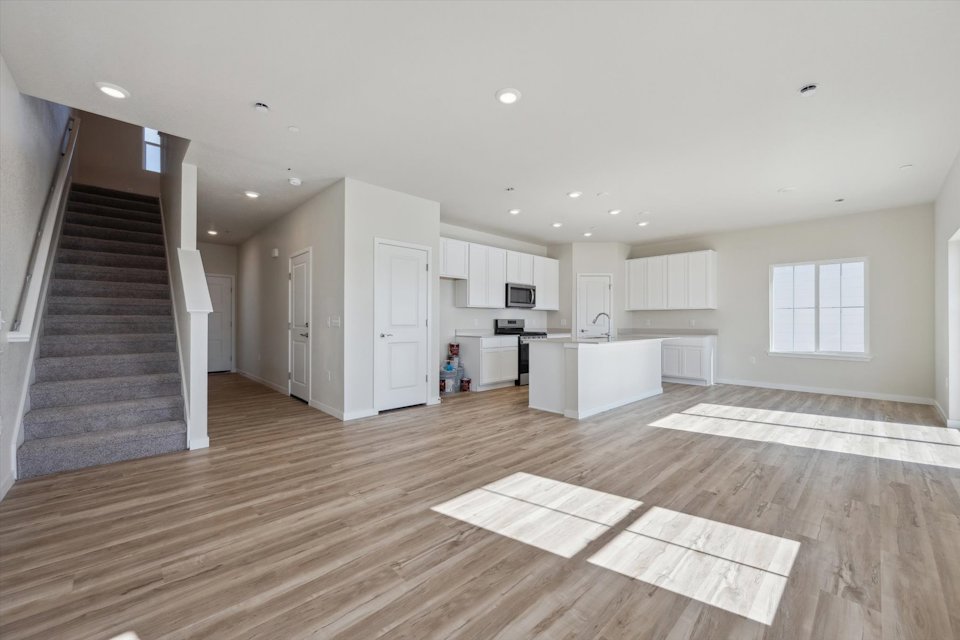 A large kitchen with white cabinets.