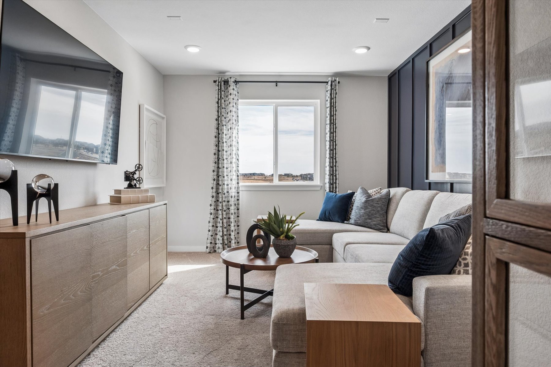 A living room with a couch and a table.