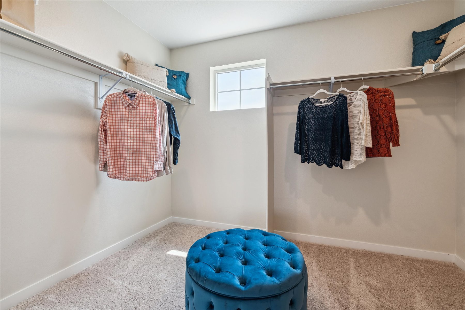 A bathroom with a blue tub and a blue bowl.