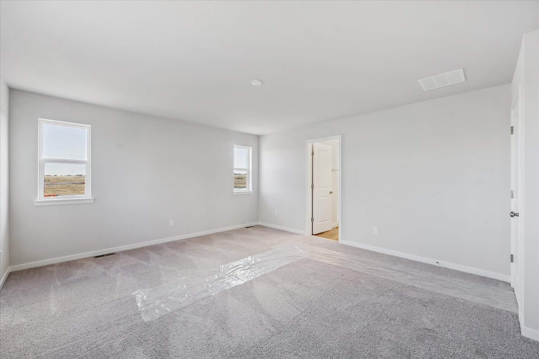 A room with a door and a window.