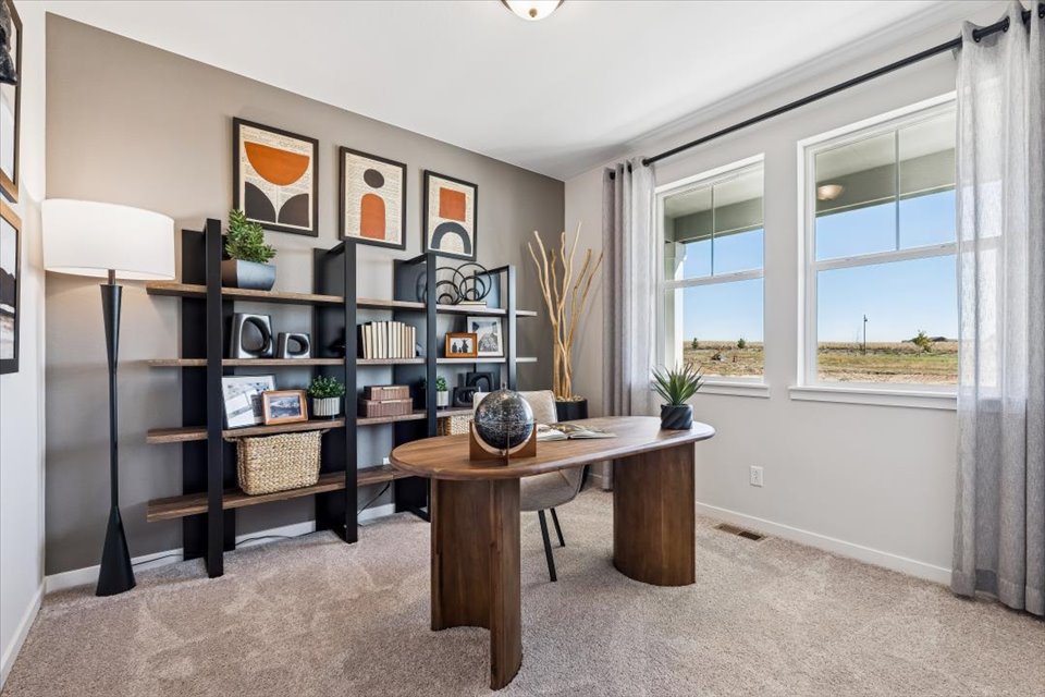 A room with a table and shelves.