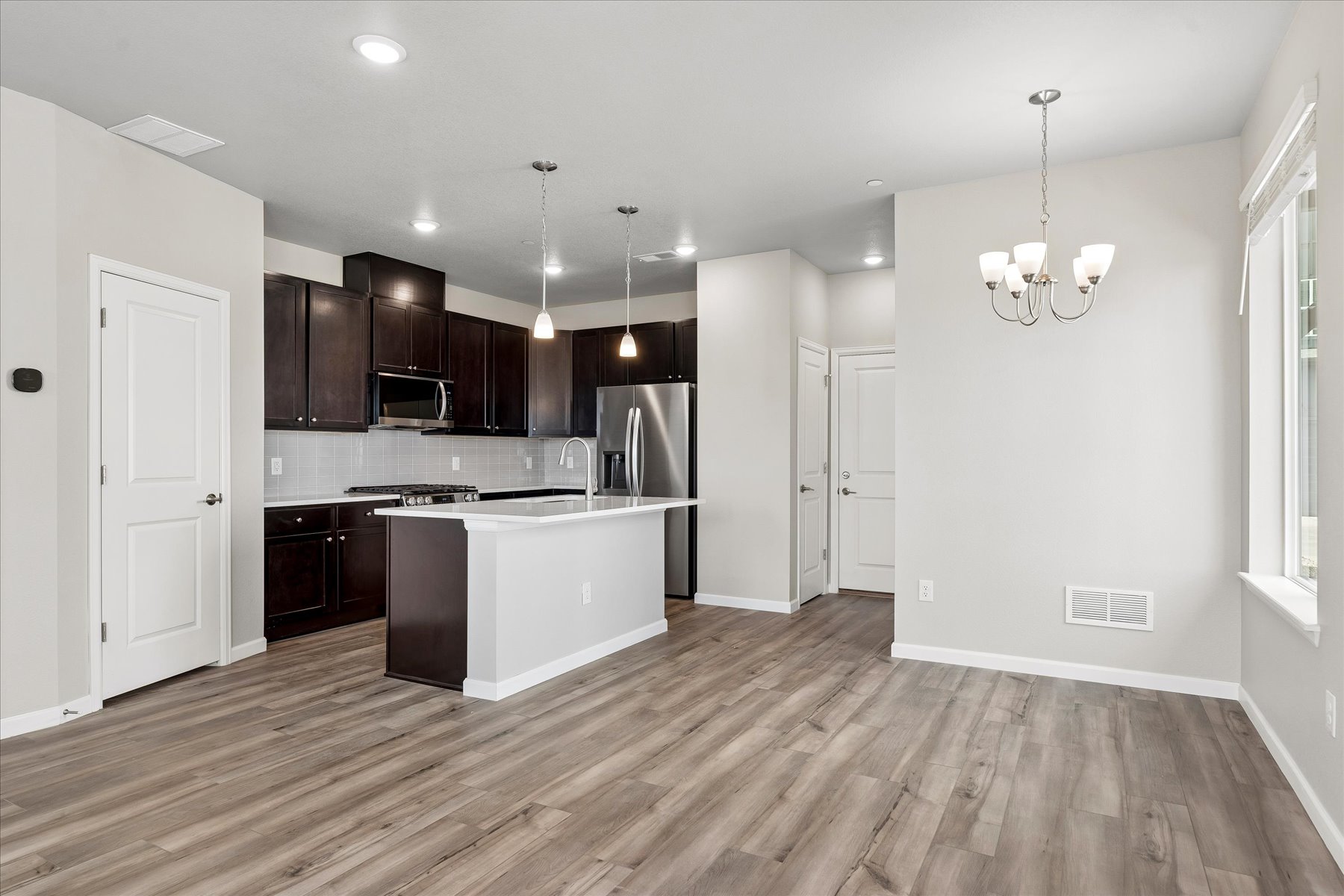 A kitchen with wooden floors.