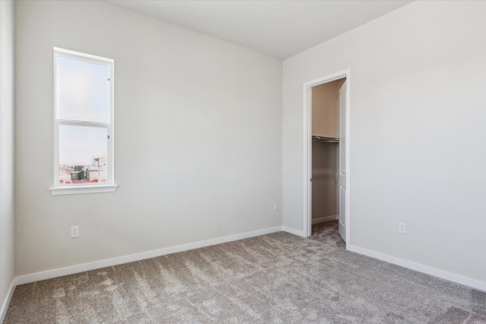 A room with a door and a window.
