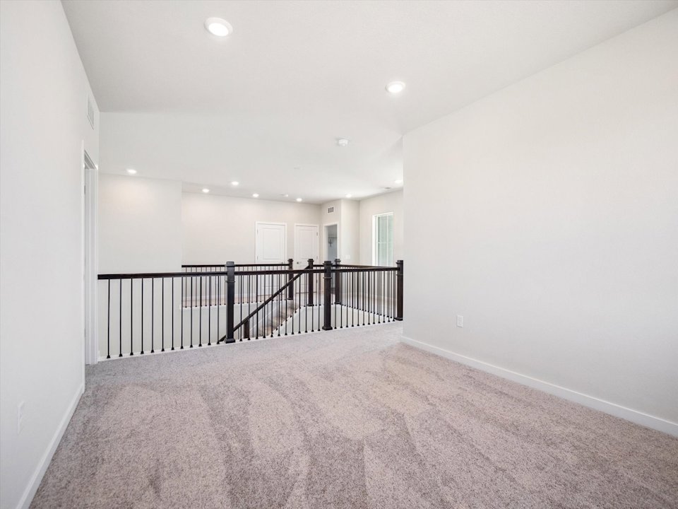 A hallway with a railing.
