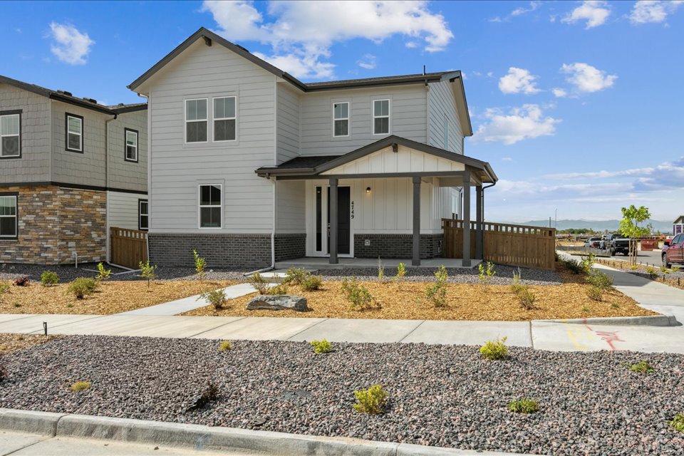 A house with a fence and a driveway.