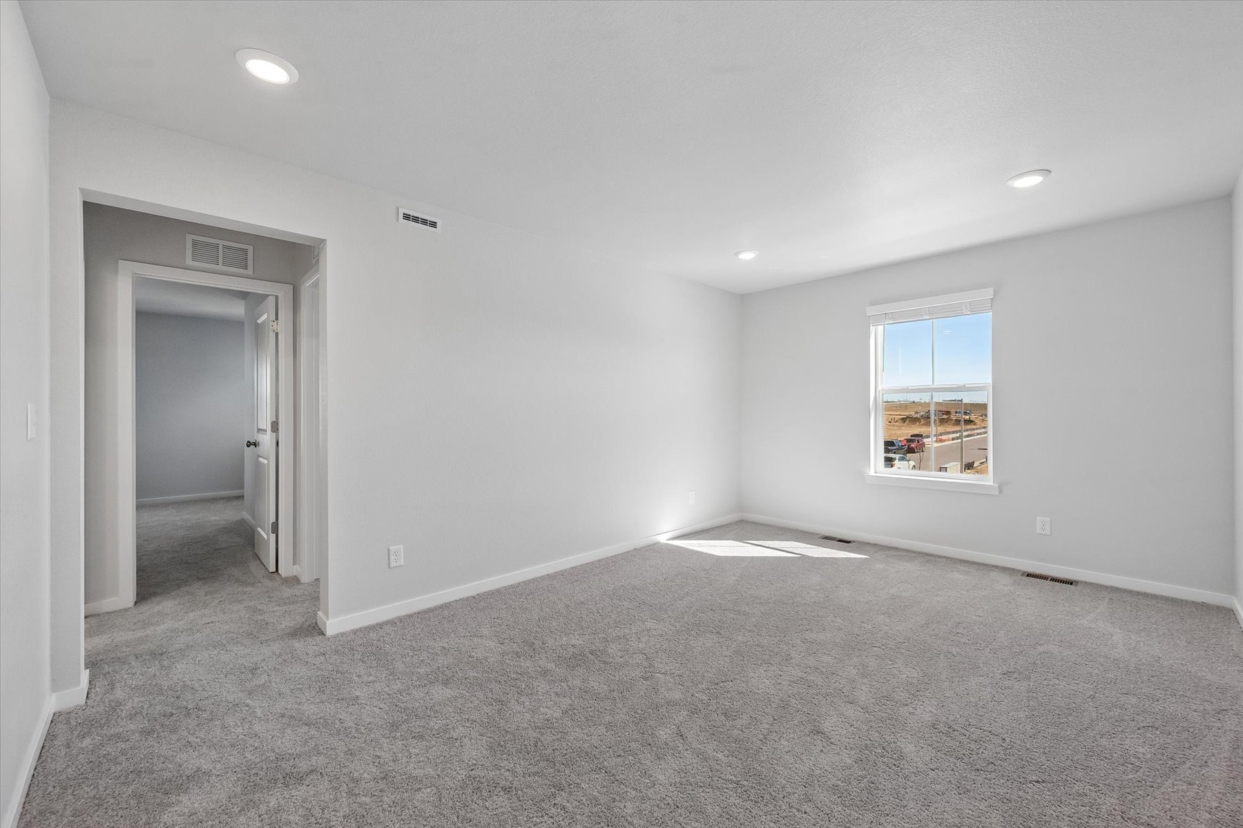 A room with a door and a window.