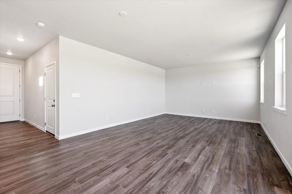 A room with wood floors.