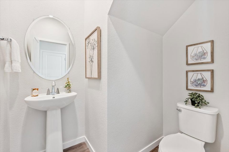 A bathroom with a sink and a mirror.