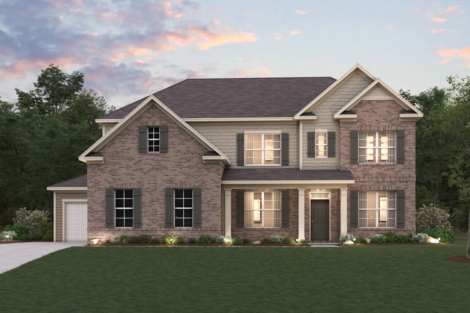 A large house with a lawn in front of it.