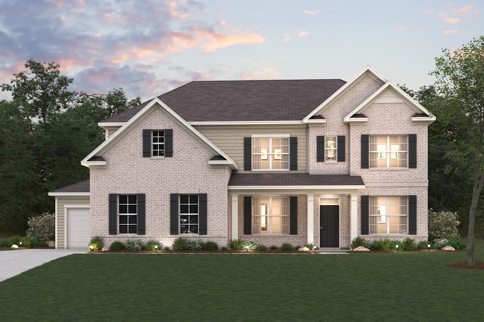A large house with a lawn in front of it.