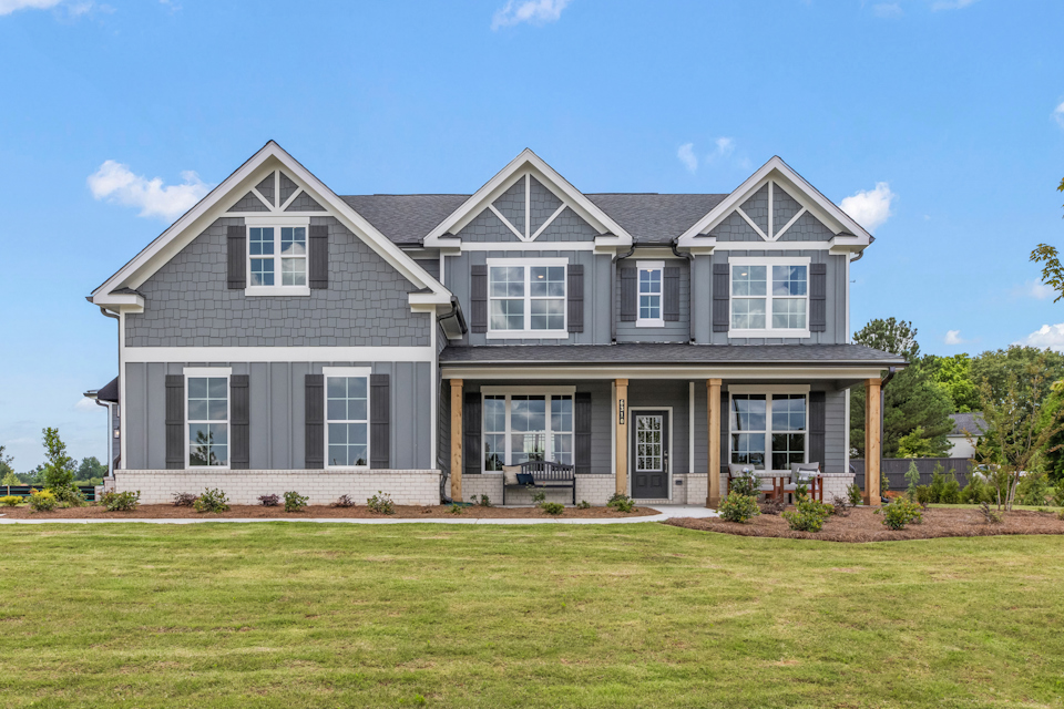 A house with a lawn in front.
