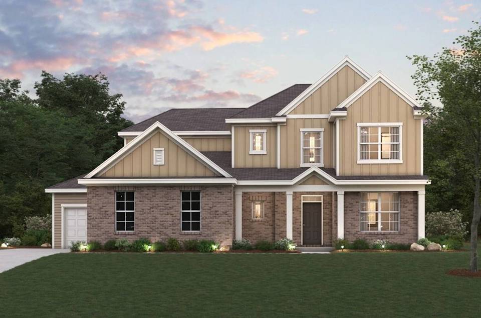A house with a lawn in front of it.