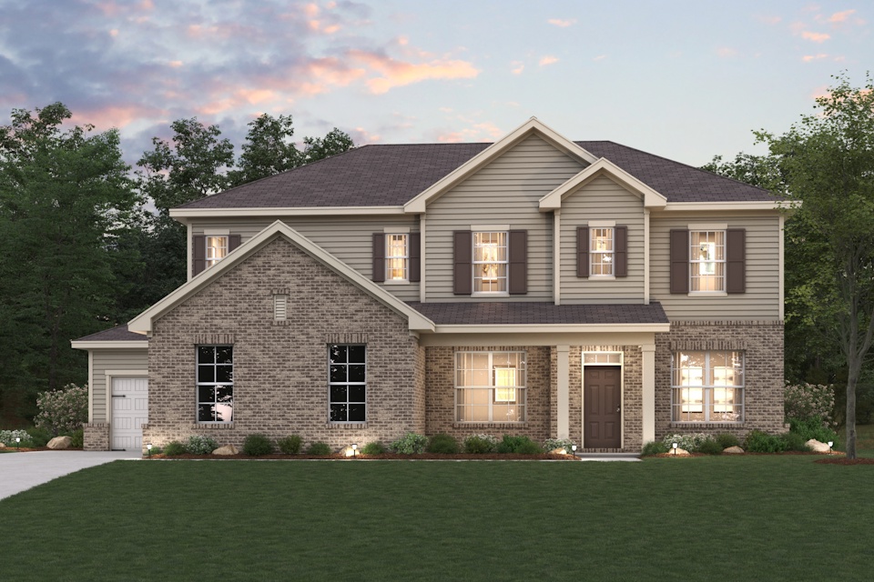 A large house with a lawn in front of it.