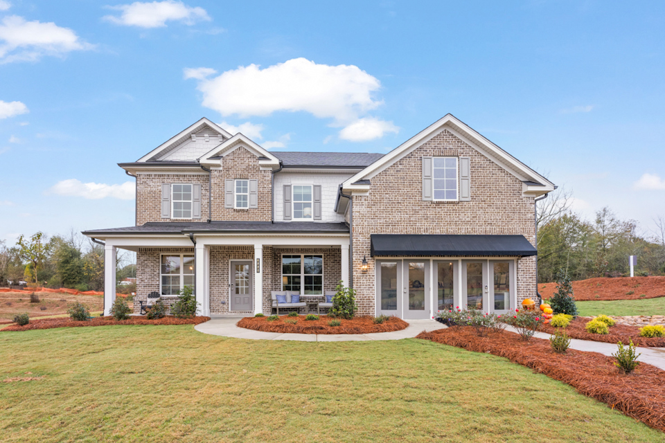 A large house with a lawn.