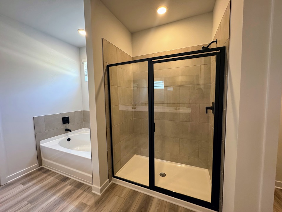 A bathroom with a glass shower.