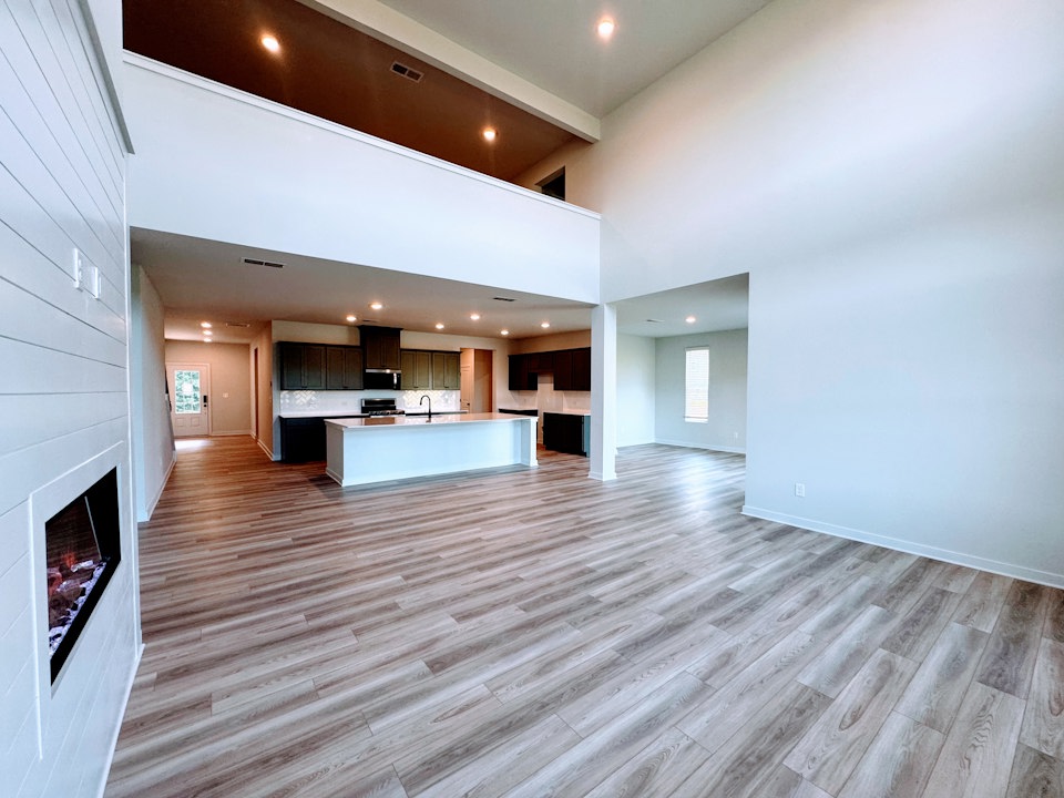 A large room with a pool.