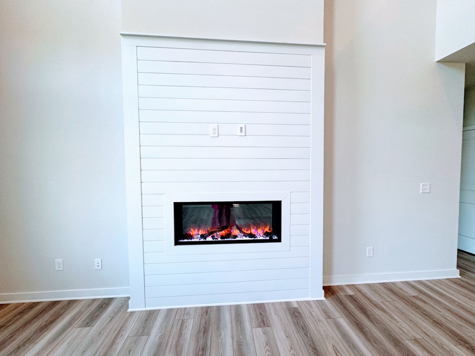 A fireplace in a room.