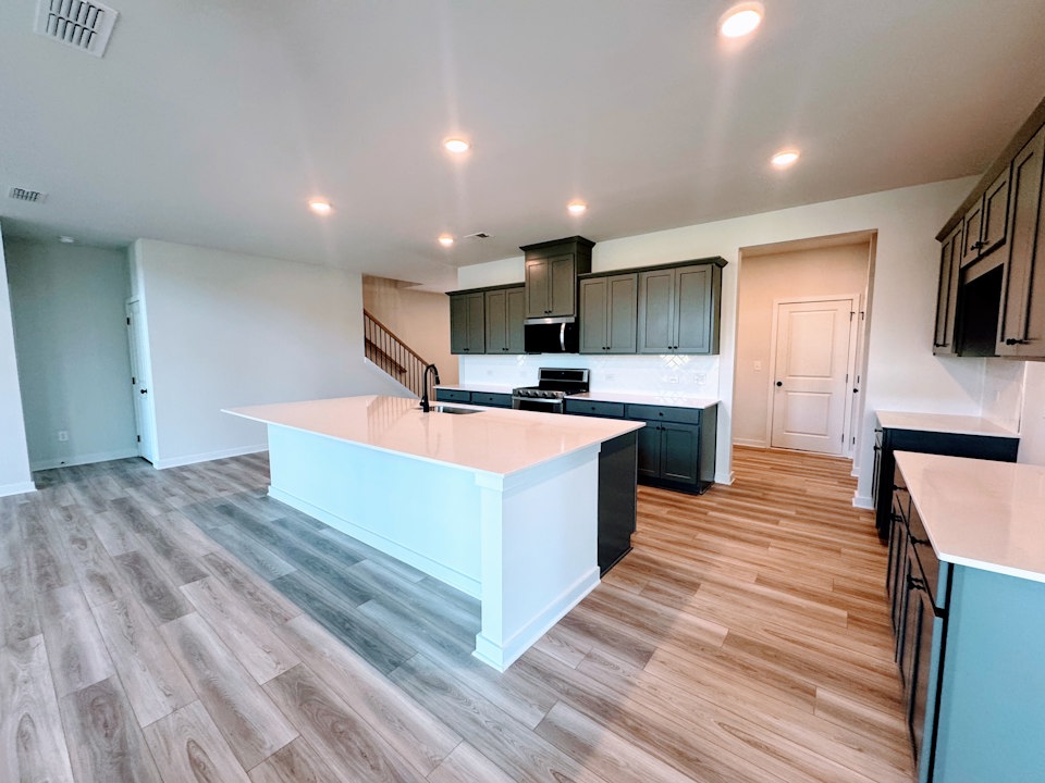 A kitchen with a large island.