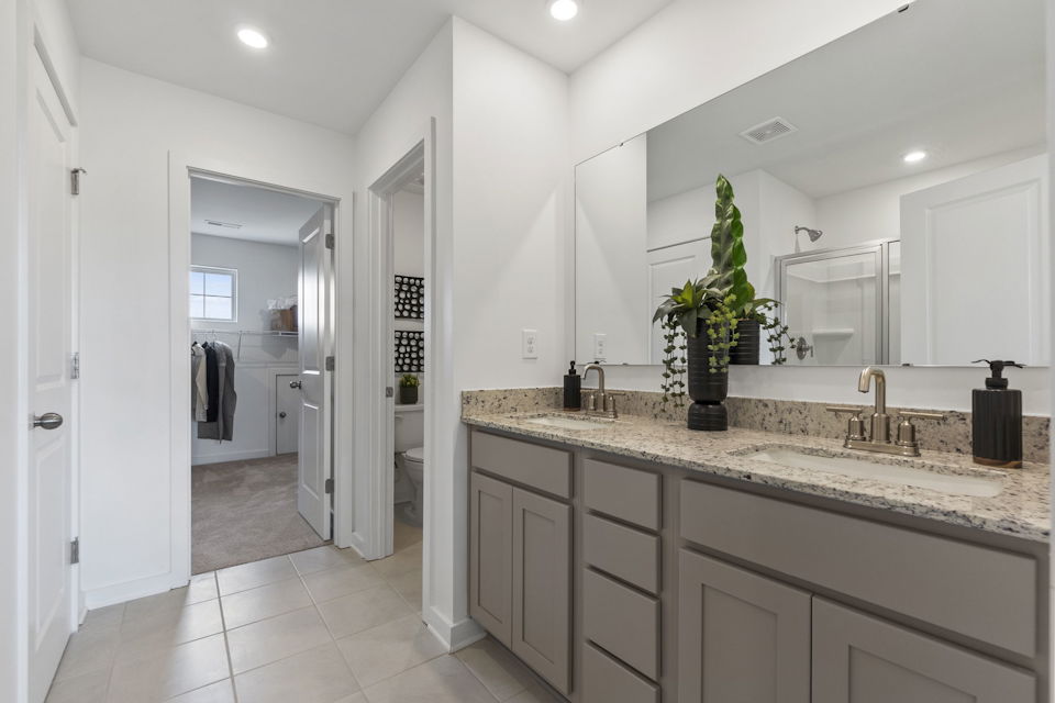 A bathroom with a marble countertop.