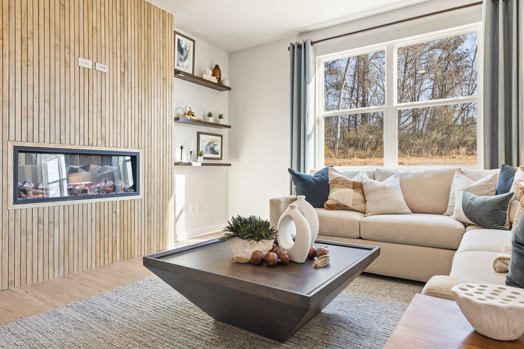 A living room with a fireplace.