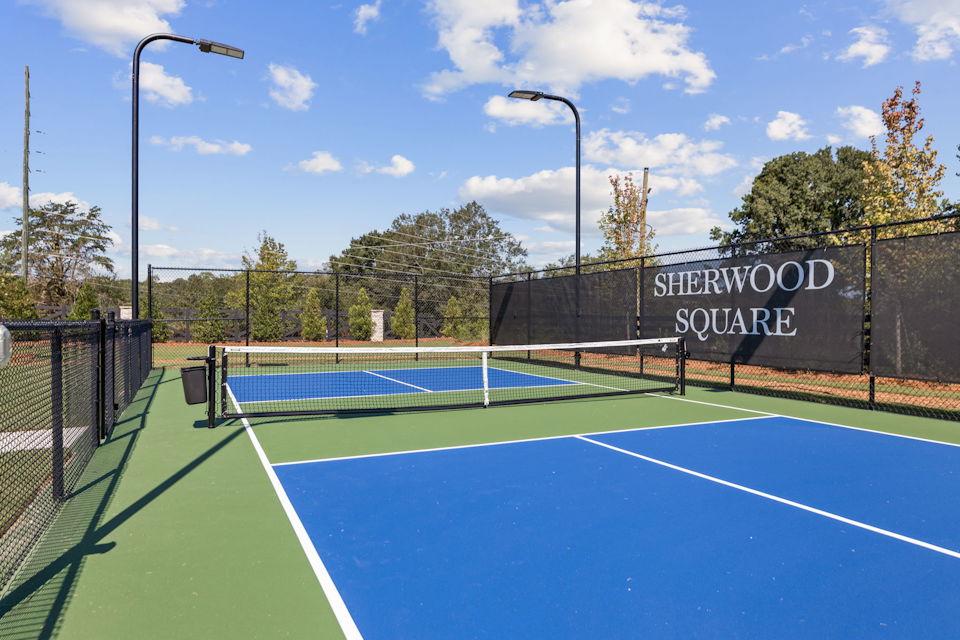 A tennis court with a net.