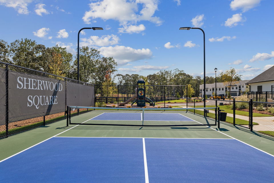 A tennis court with a net.