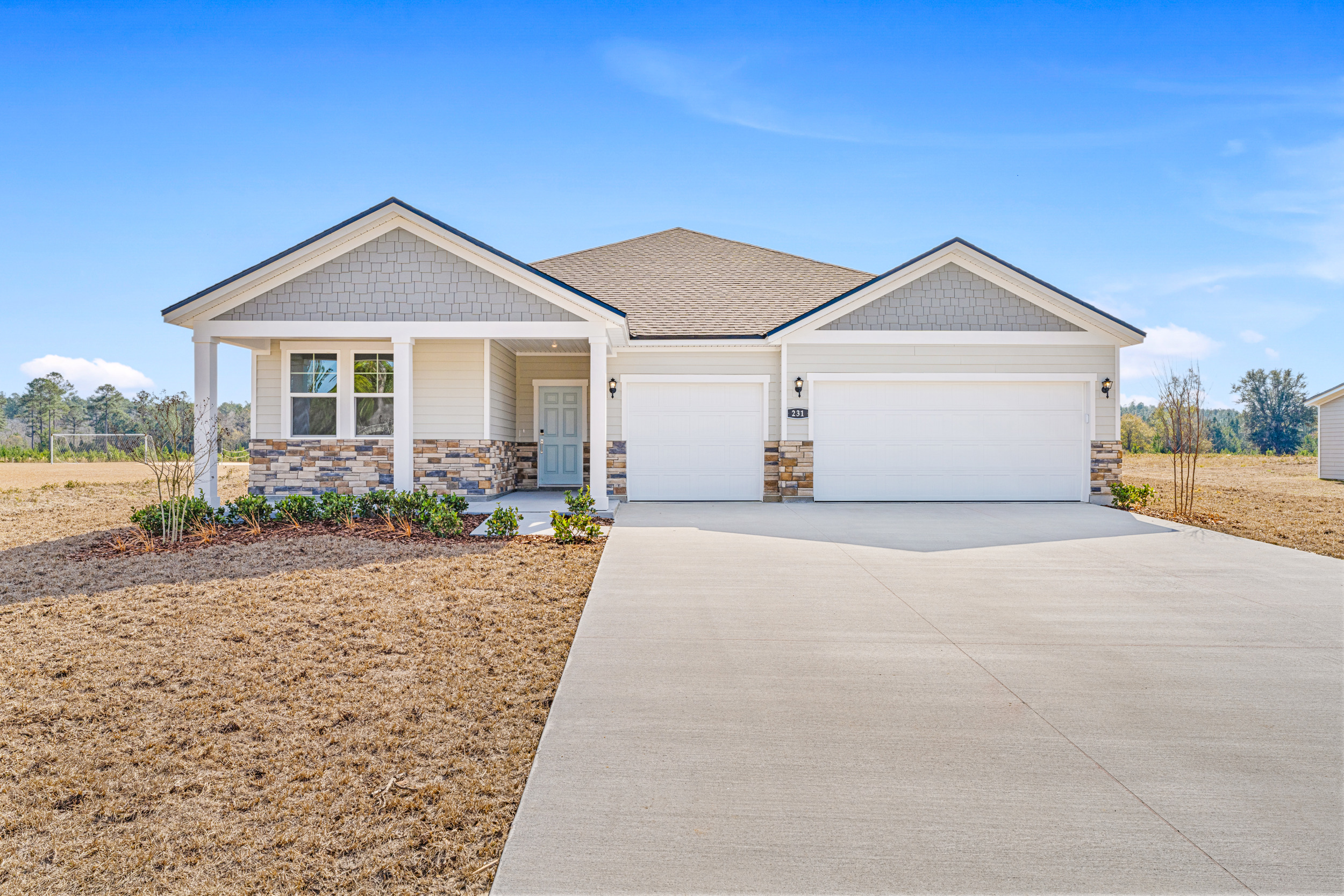 Lot 596 Front Exterior with 3-Bay Garage and Stone at NorthShore