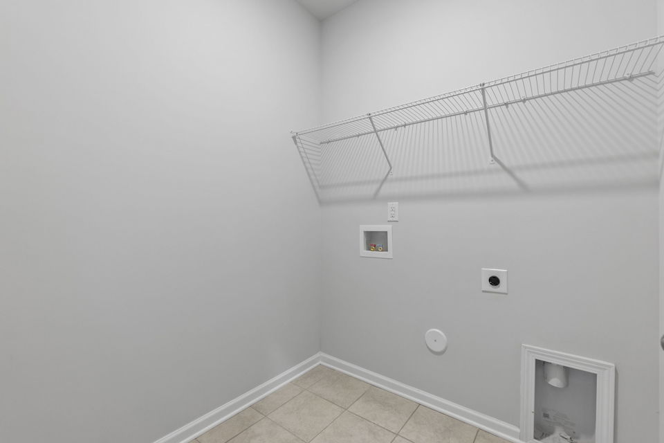 A white wall with a vent and a vent.