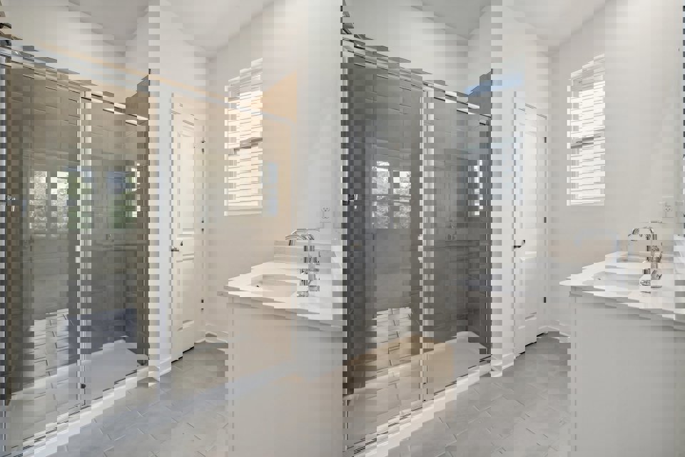 A bathroom with a glass shower.