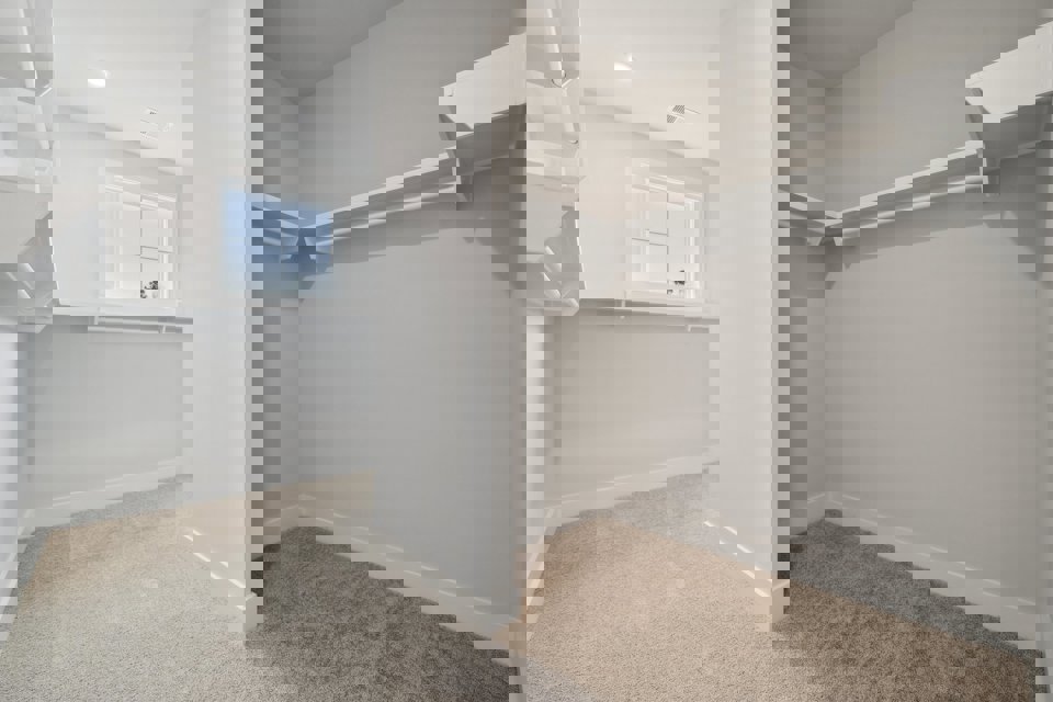 A white room with a window.
