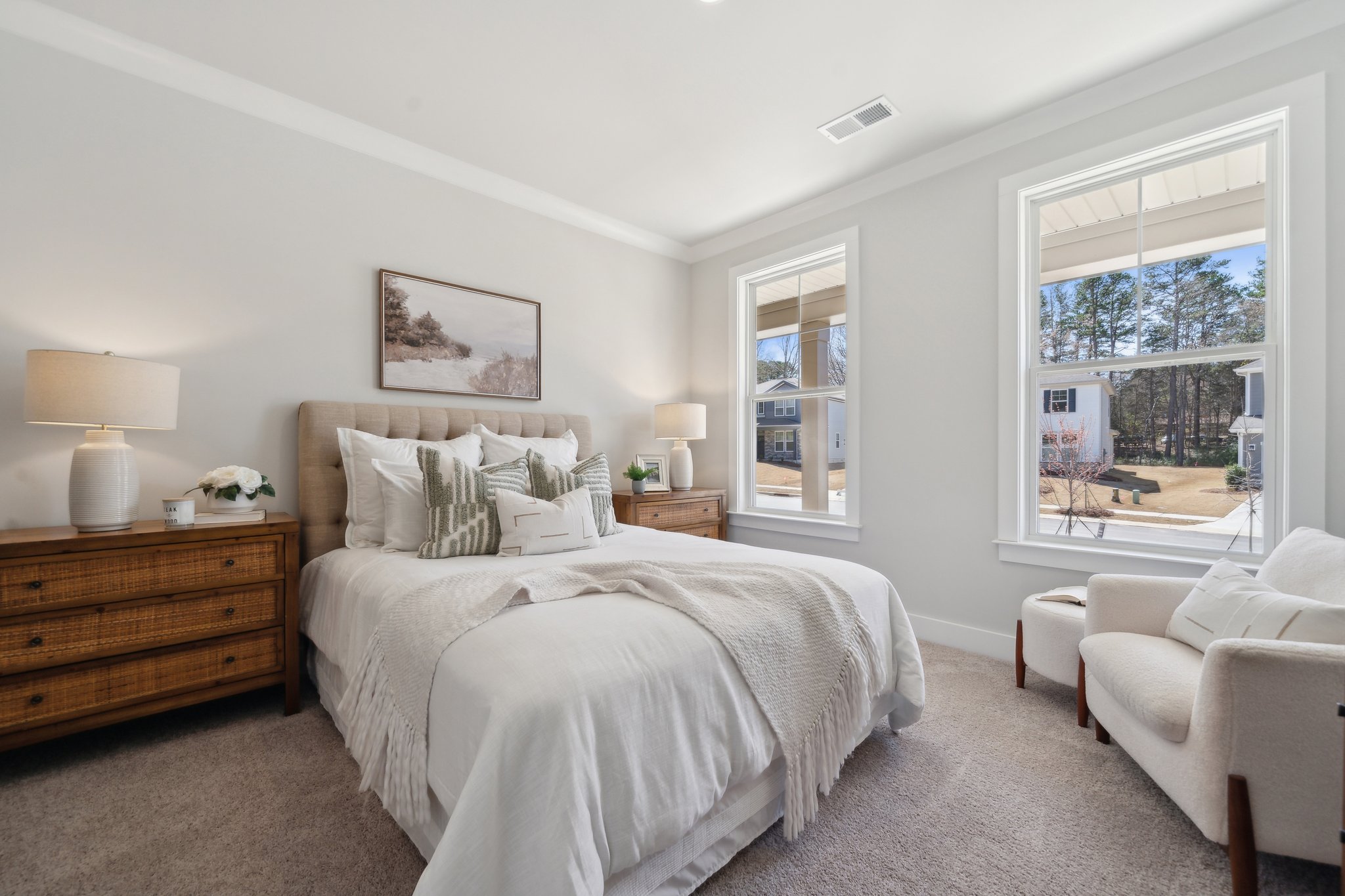 A bedroom with a large window.