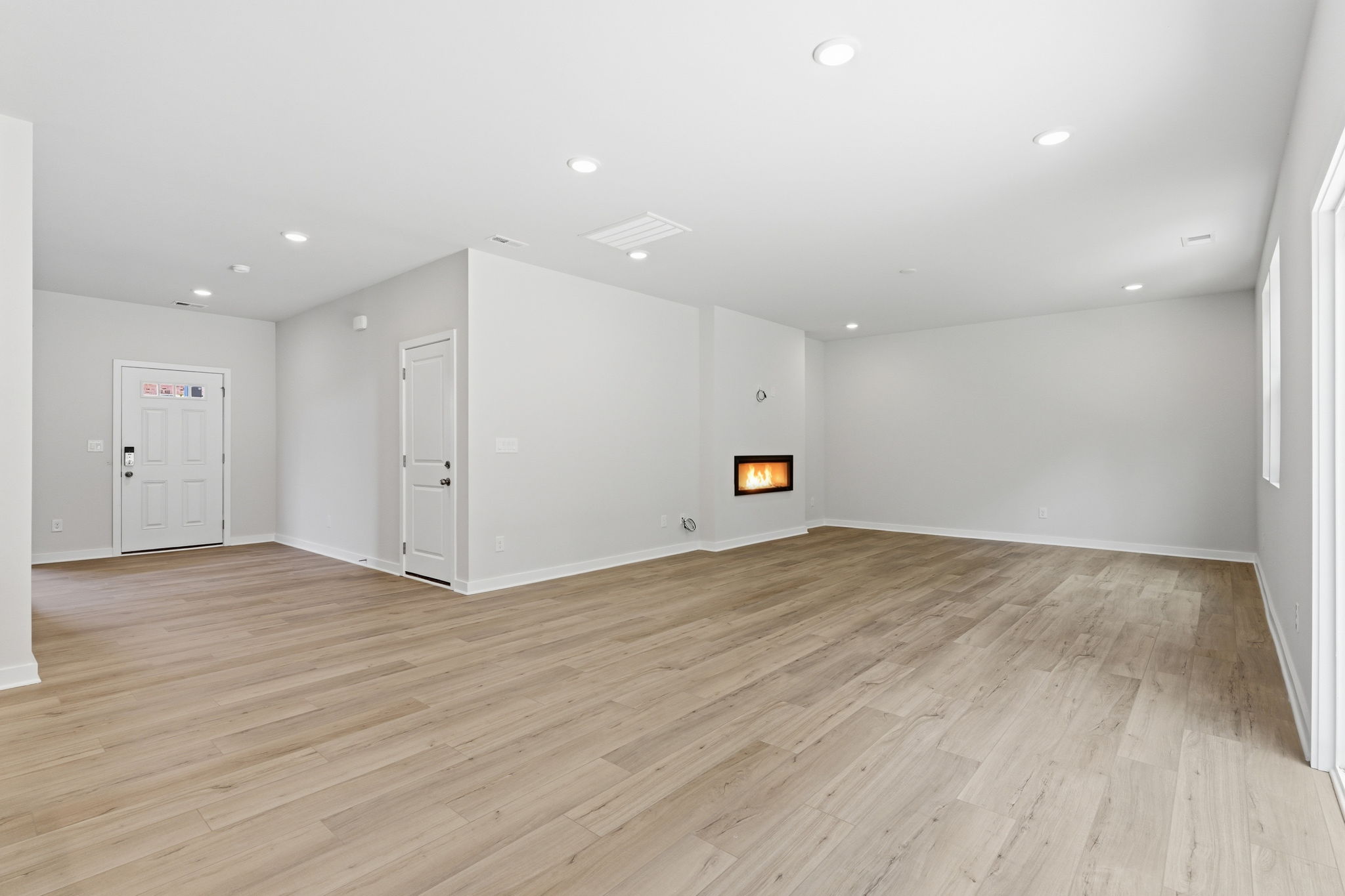A room with wood floors.
