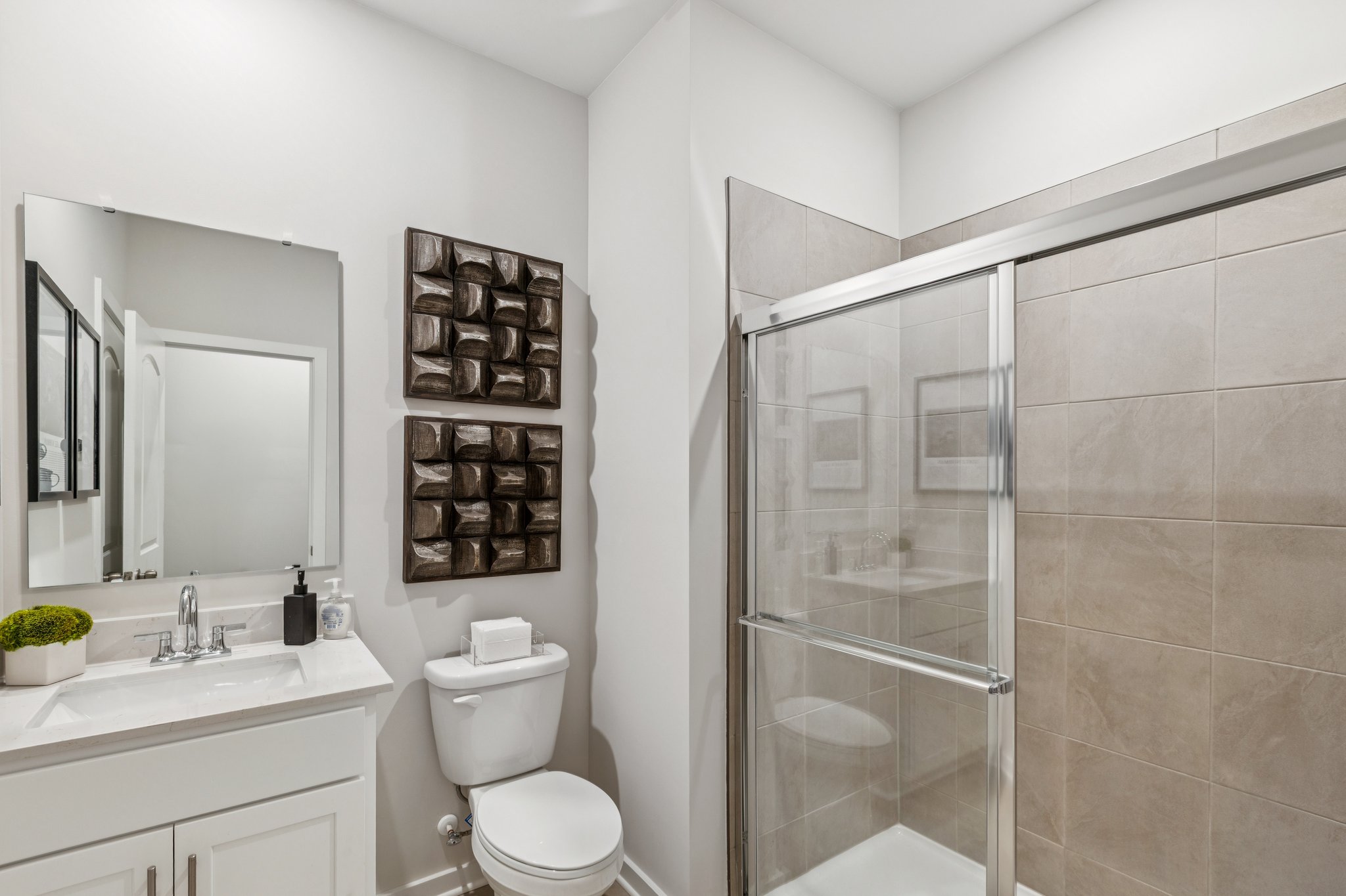 A bathroom with a glass shower.