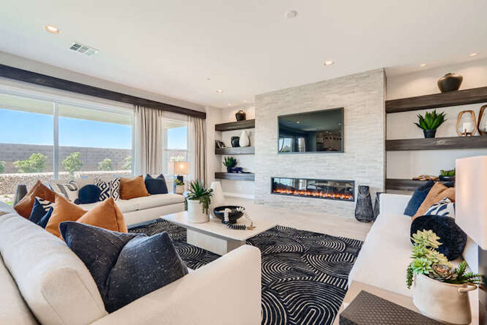 A living room with a fireplace.