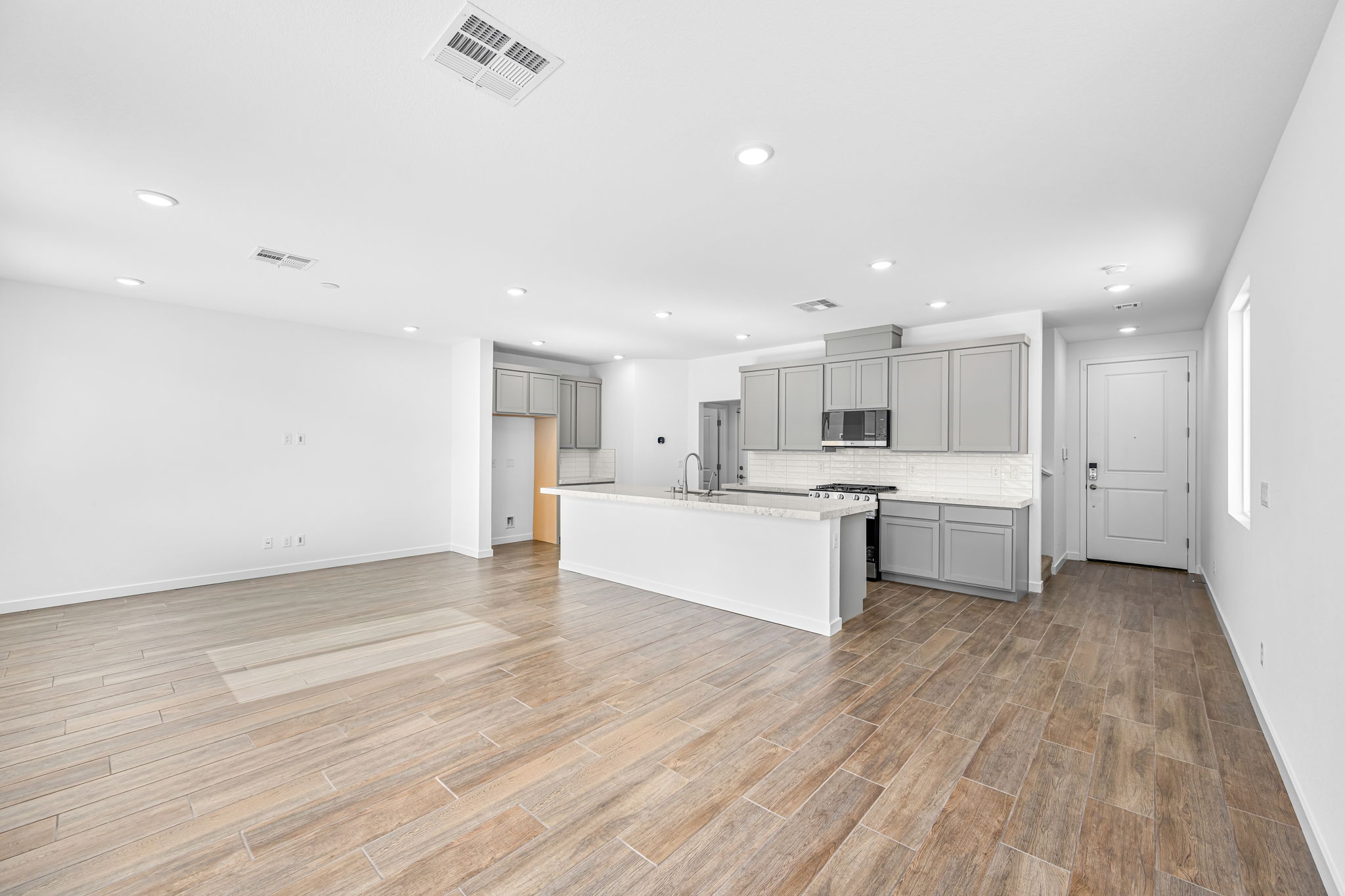 A large kitchen with white cabinets.