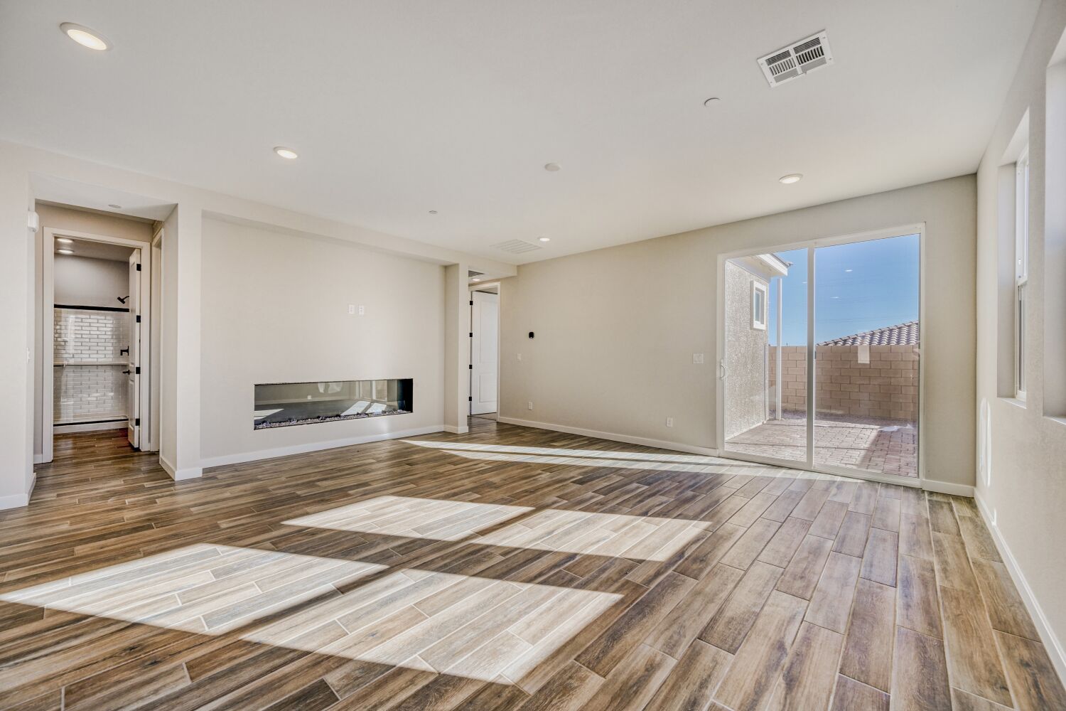 A room with a wood floor and a wood floor.