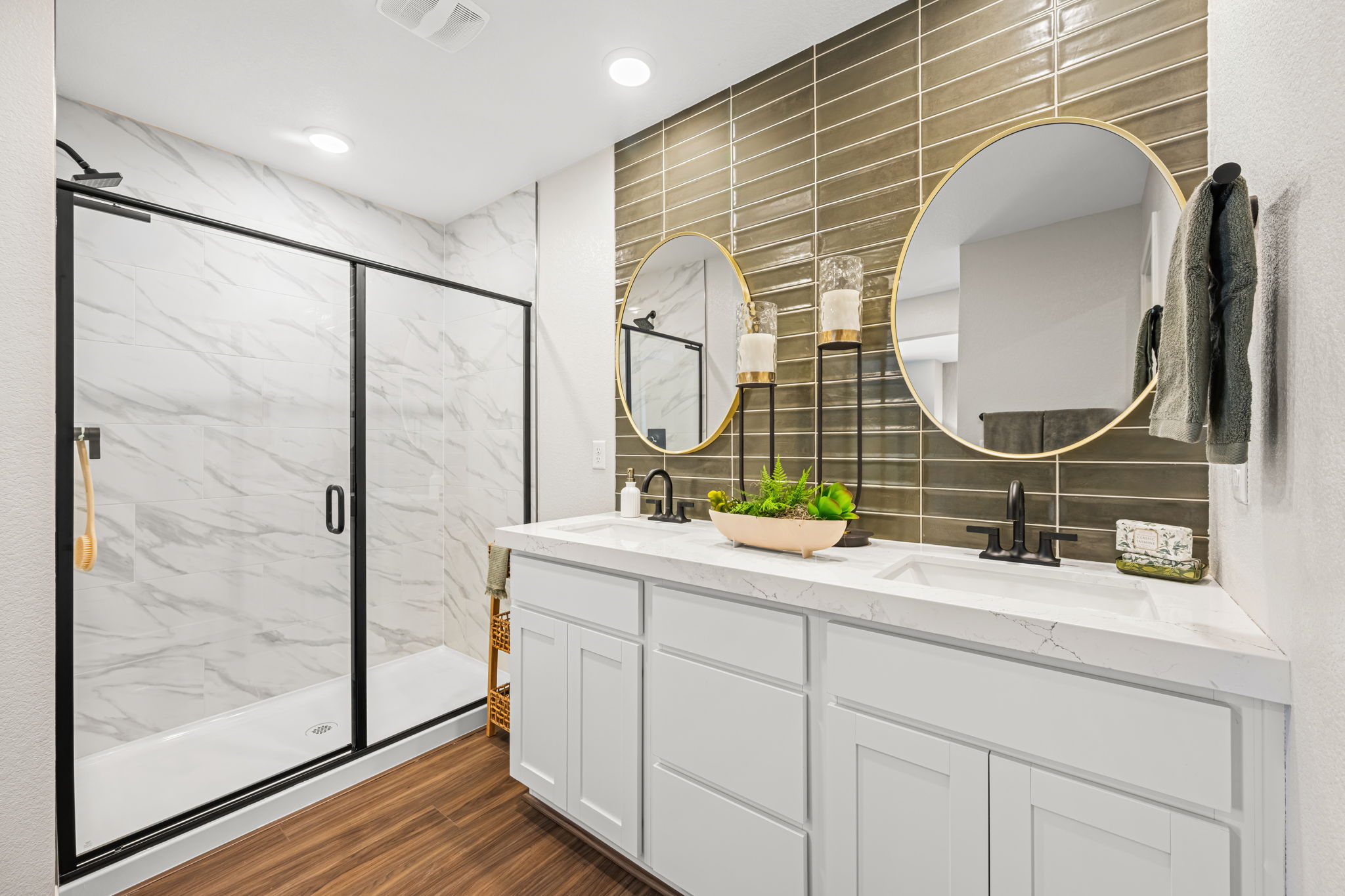 A bathroom with a large mirror.