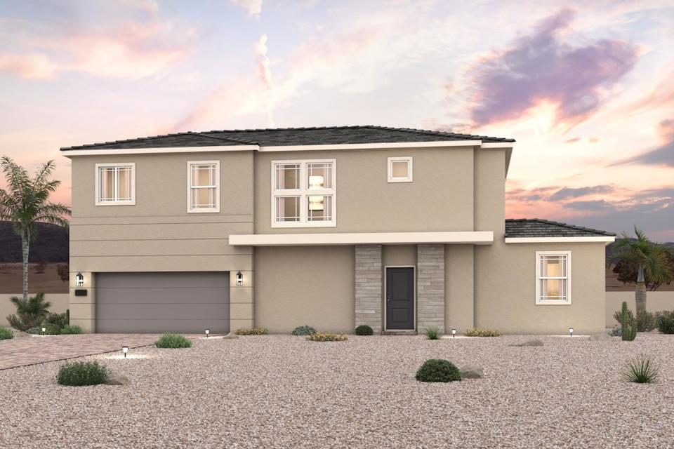 A house with a gravel driveway.