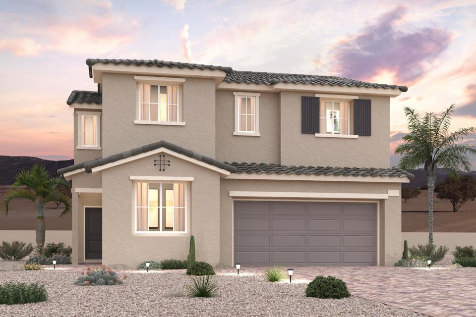 A house with a garage and palm trees.