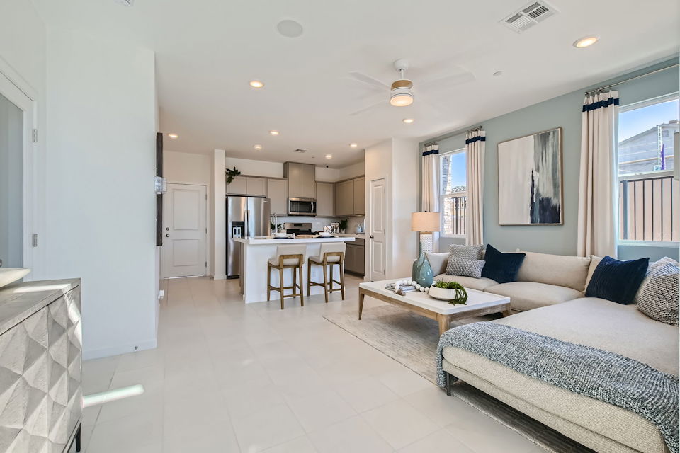 A large bedroom with a bed and a table.