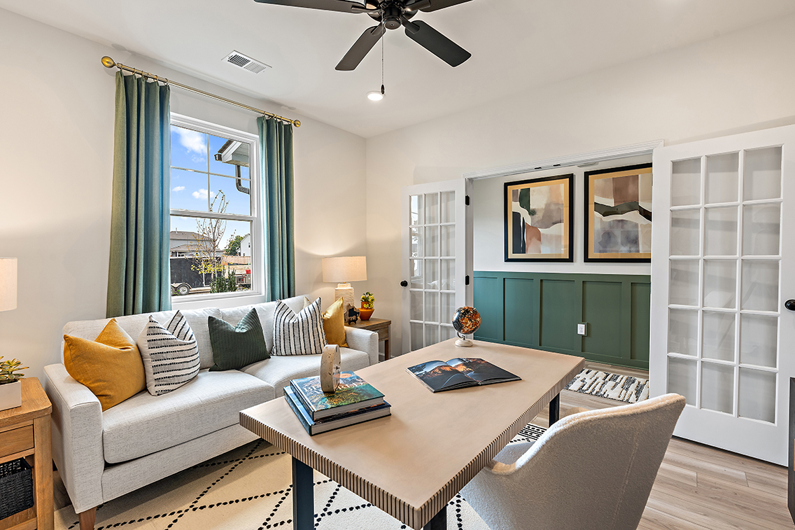 A living room with a couch and a table.