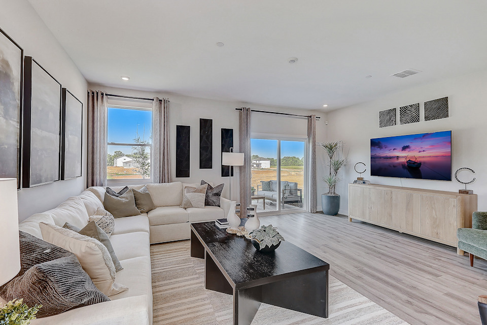 A living room with a tv and couches.